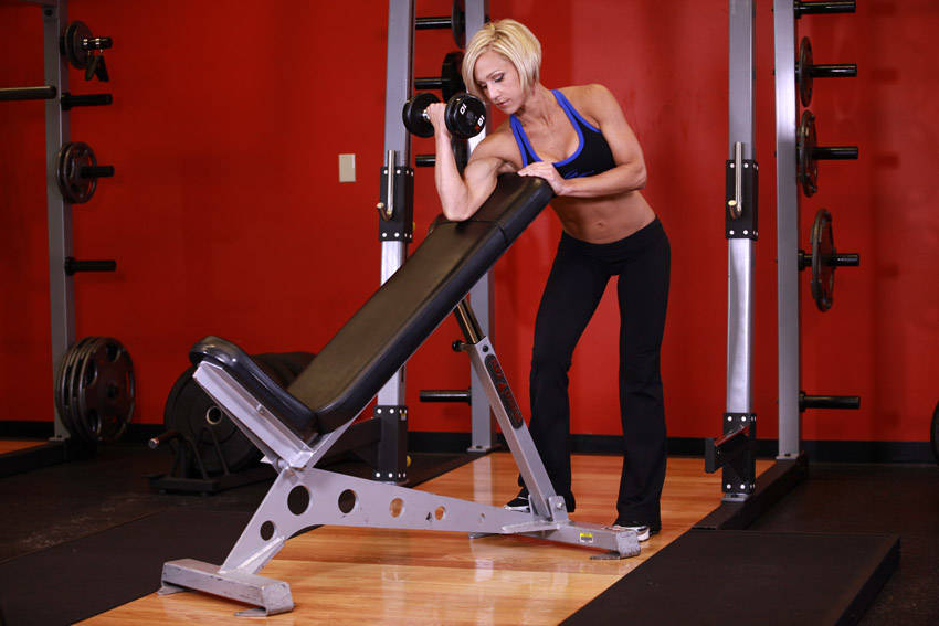 Standing One-Arm Dumbbell Curl Over Incline Bench Exercise ...