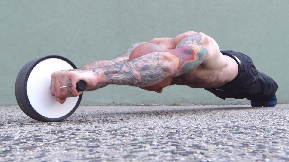 How to Use an Ab Roller to Train Your Core and Build a Six-Pack