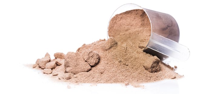 A scoop of chocolate protein powder