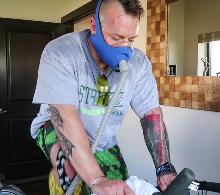 Kris Gethin training with an elevation mask. 