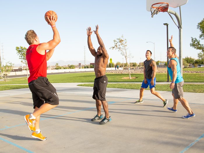 Playing basketball outdoors