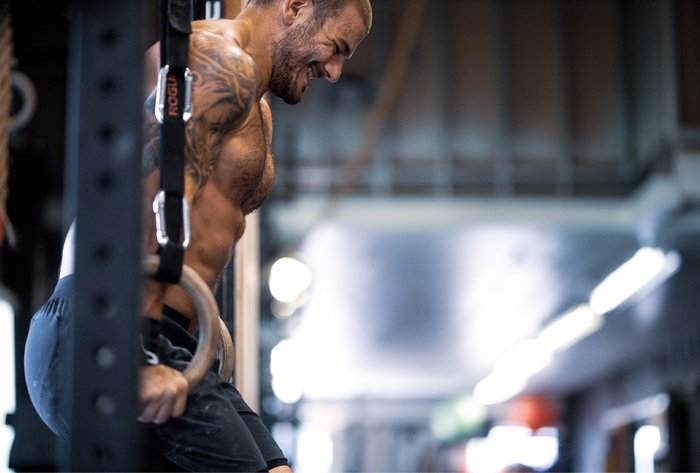 Mat Fraser performing ring dips