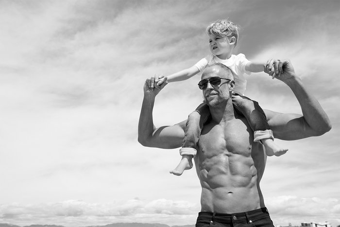 Todd Abrams, a fitness entrepreneur, holds his son on his shoulders during a recent photo shoot.
