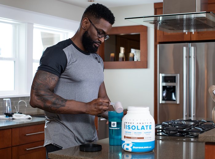 Preparing a whey protein shake. 