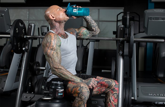 Jim Stoppani drinking a protein shake