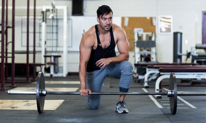 Preparing to lift a heavy barbell. 