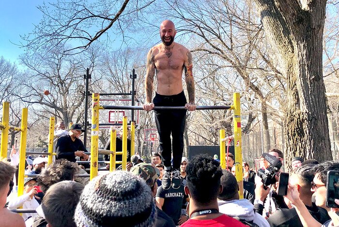 Al Kavadlo on an outdoor pull-up bar. 