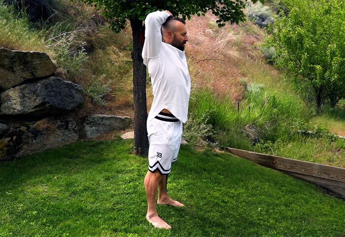 Kris Gethin performing the grounding technique