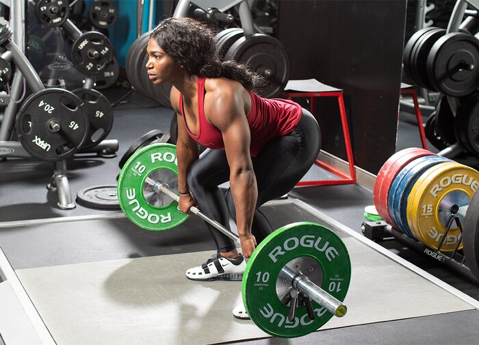 Quiana Welch performing an olympic lift 