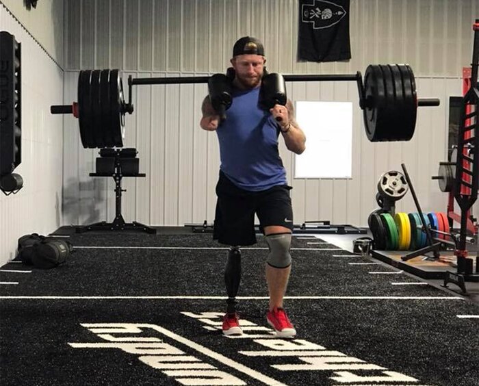 Jared Bullock using a safety squat bar to lift