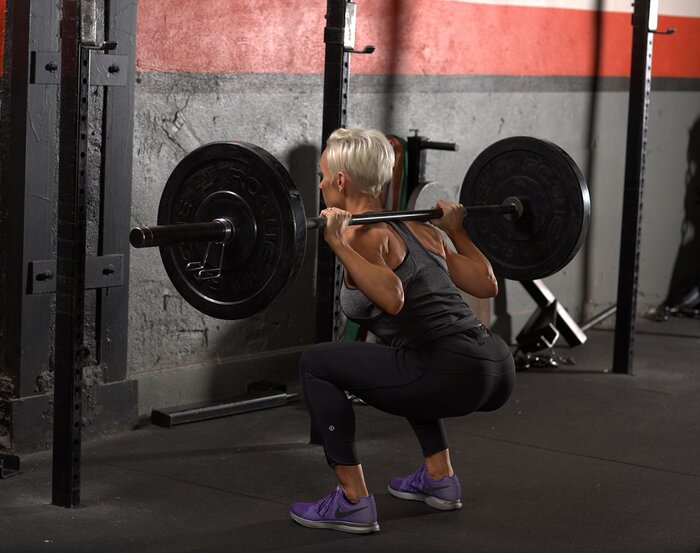 Jessie Hilgenberg performing a squat in the gym
