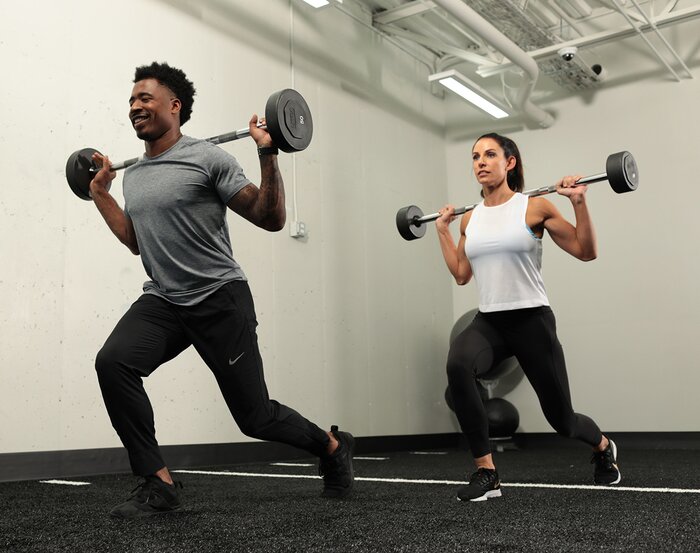 Dumbbell lunges with a partner
