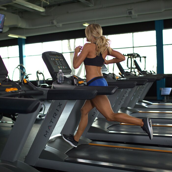 Woman Running on Treadmill