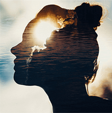 silhouette of a woman and the water