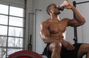 Athlete drinking Six Star Whey Isolate